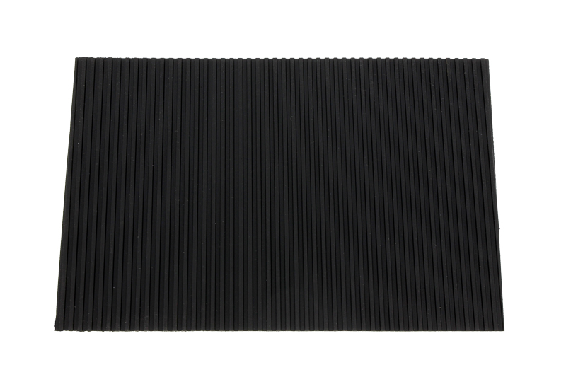 Adhesive grooved rubber pad